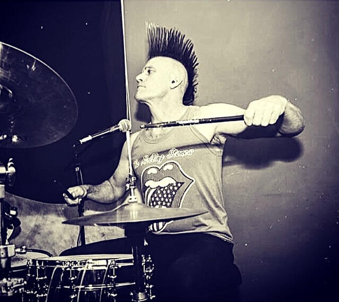 Nick drumming Picture of Nick Mather playing the drums at a gig in Sheffield