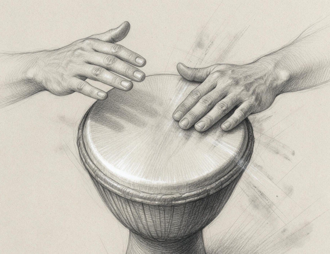 A picture of a pair of hands playing a djembe (a drum)